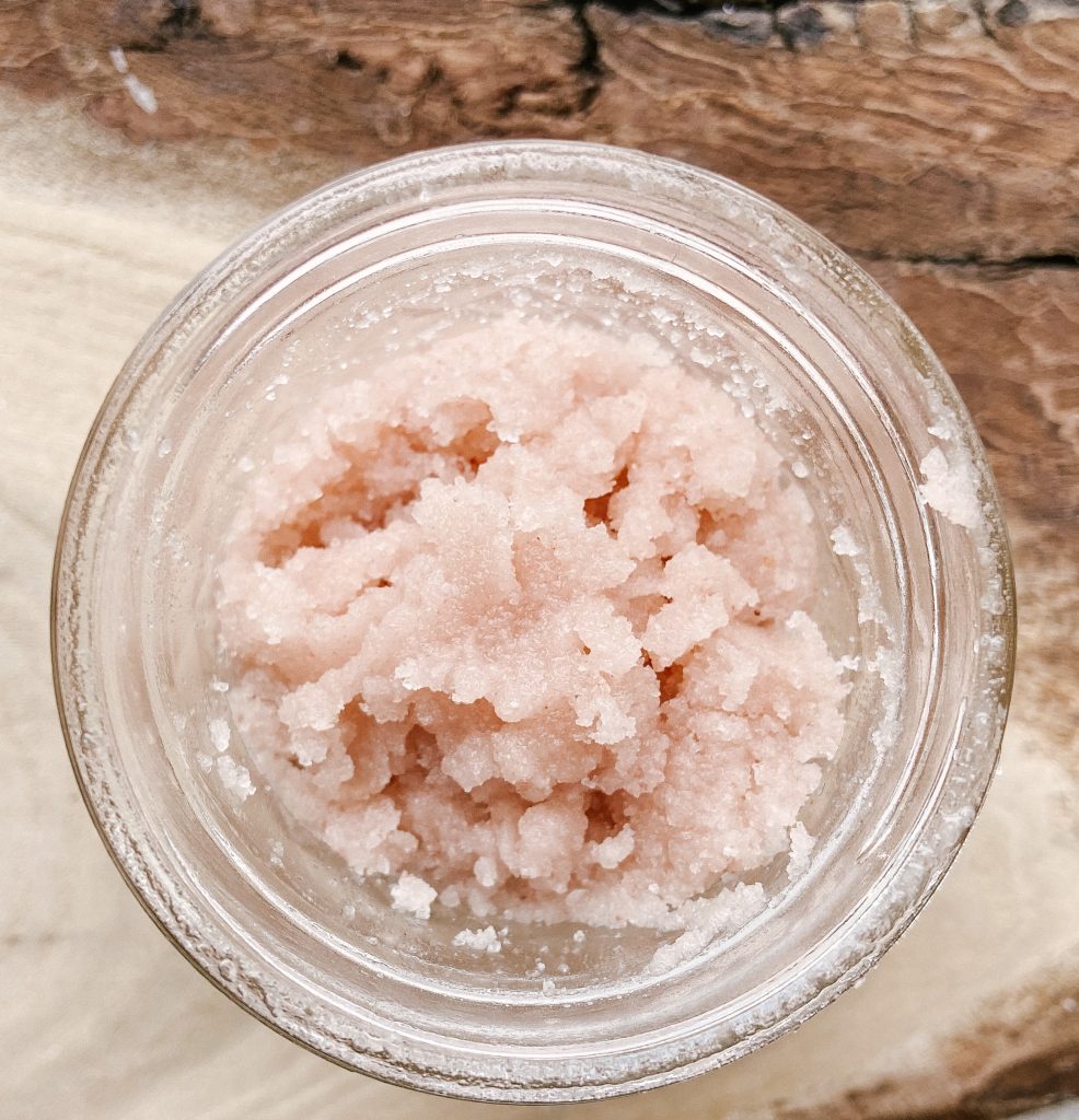 homemade pink himalayan salt body scrub in glass jar